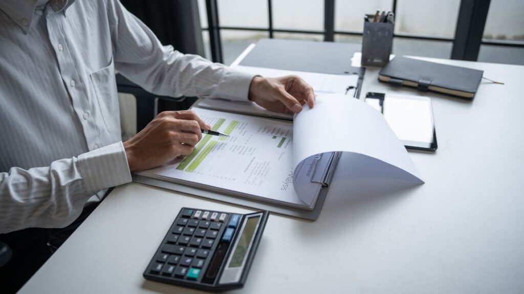 Executive reviewing business data to improve leadership performance during market shifts