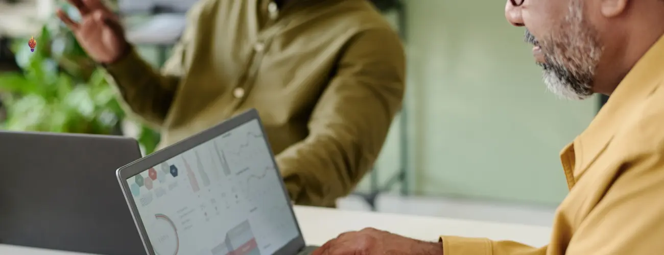 marketing assessment for small business reviewing analytics dashboard with team