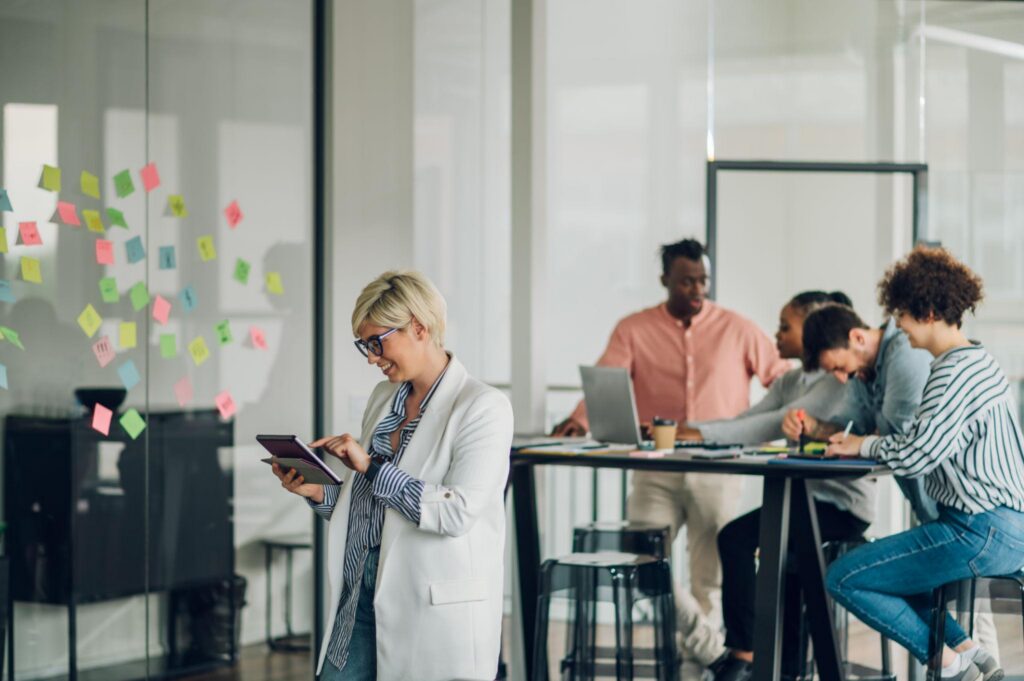 Founder stepping back while a team works independently